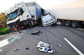 An accident involving a big rig and a sedan