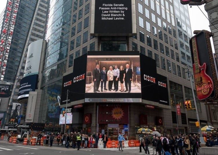 A photograph of Mr. and Mrs. Coffey at the Florida Legislature along with David Bianchi, Michael Levine and Steve Cain from our firm appeared on the famous billboard in Times Square in New York City.